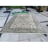 A good large Persian design cream ground hunting pattern carpet.
