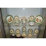 A late 19th century topographical tea service, each item painted with a different landscape and