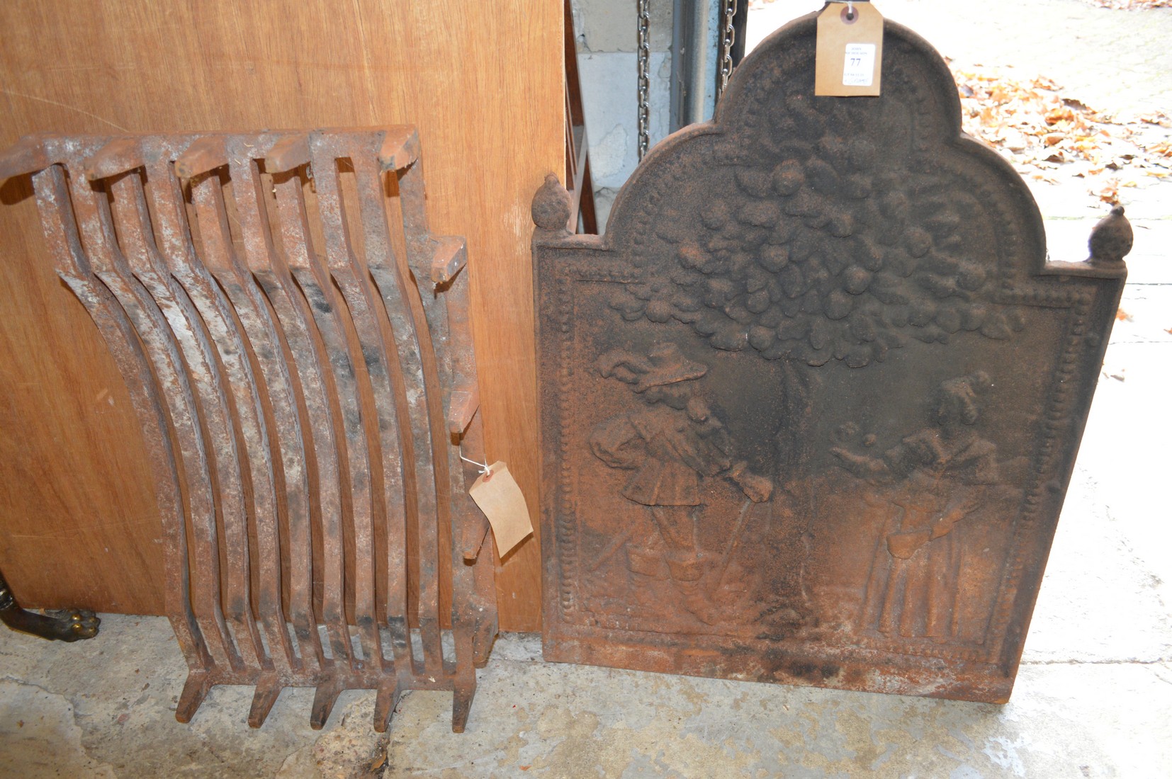 A cast iron fire back and a grate.