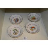 Four small porcelain dishes.