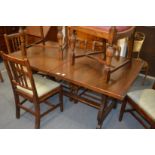 An oak refectory style extending dining table.