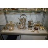 A pair of silver plated entree dishes and covers, a kettle on stand with burner, a good muffin