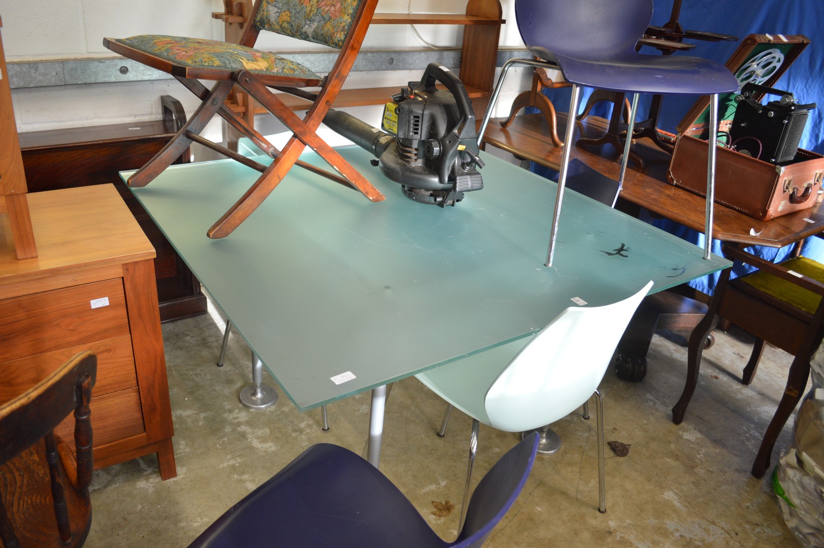 A stylish frosted glass and chrome framed dining table with five Maui chairs made for Kartell.