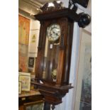 A walnut cased Vienna style regulator wall clock.