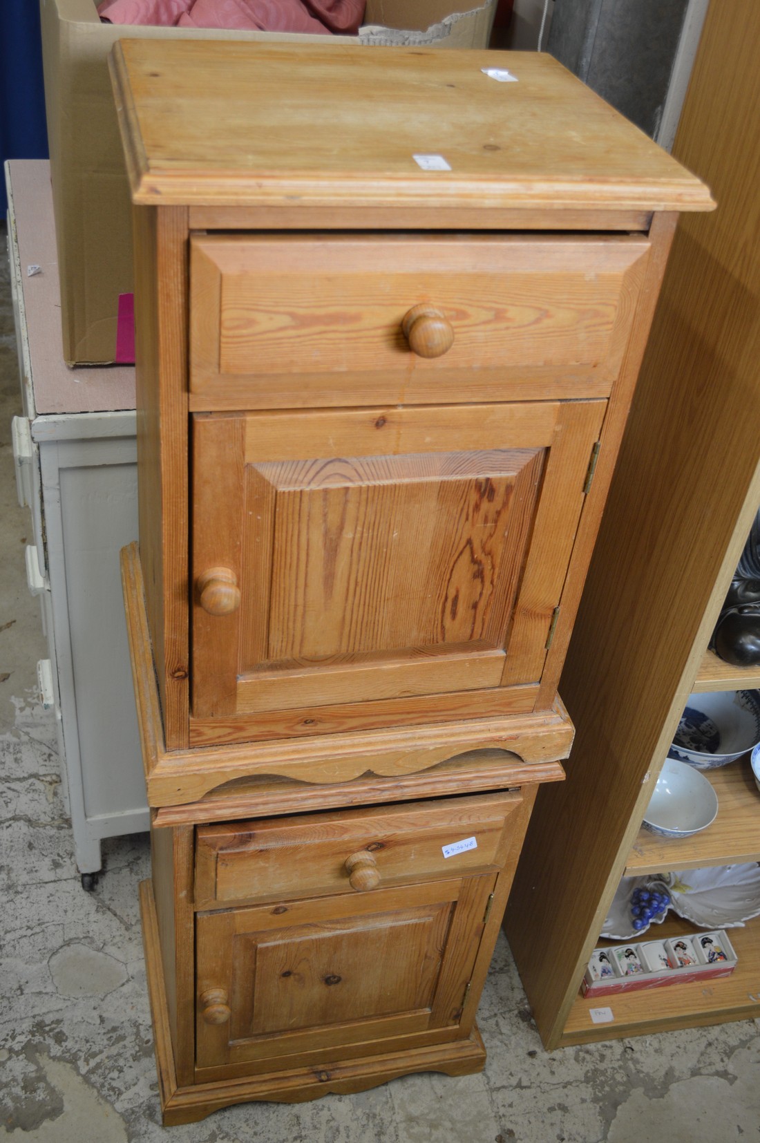 A pair of pine bedside cupboards.