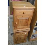 A pair of pine bedside cupboards.