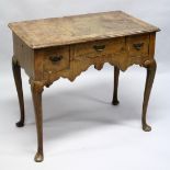 AN 18TH CENTURY WALNUT LOW BOY, with a crossbanded top, three drawers above a shaped apron, on