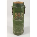 A 19TH / EARLY 20TH CENTURY GREEN PAINTED CANVAS SHELL CARRIER, with leather handle and applied coat