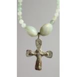 A ROMAN CAST IRON CROSS on bead necklace.