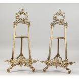 A PAIR OF BRASS EASELS.