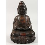 A CHINESE BRONZE SEATED GOD. 8ins high.