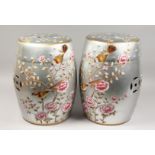 A PAIR OF SILVERED CHINESE PORCELAIN BARREL SEATS with flowers and birds. 17.5ins high.