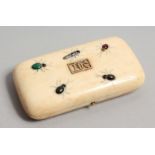 A GOOD IVORY CASED NECESSAIRE with scissors, thimble etc., with insects on the lid. 4.25ins x 2.