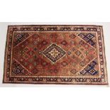 A PERSIAN JOSHAQAN RUG, pink ground with allover floral decoration. 7ft 2ins x 4ft 6ins.