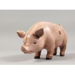 A CAST IRON PIG MONEY BOX. 7ins long.