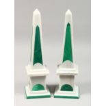 A PAIR OF TWO-COLOUR MARBLE OBELISKS on square bases. 16.5ins high.