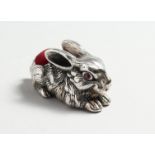 TWO SILVER RABBIT PINCUSHIONS.