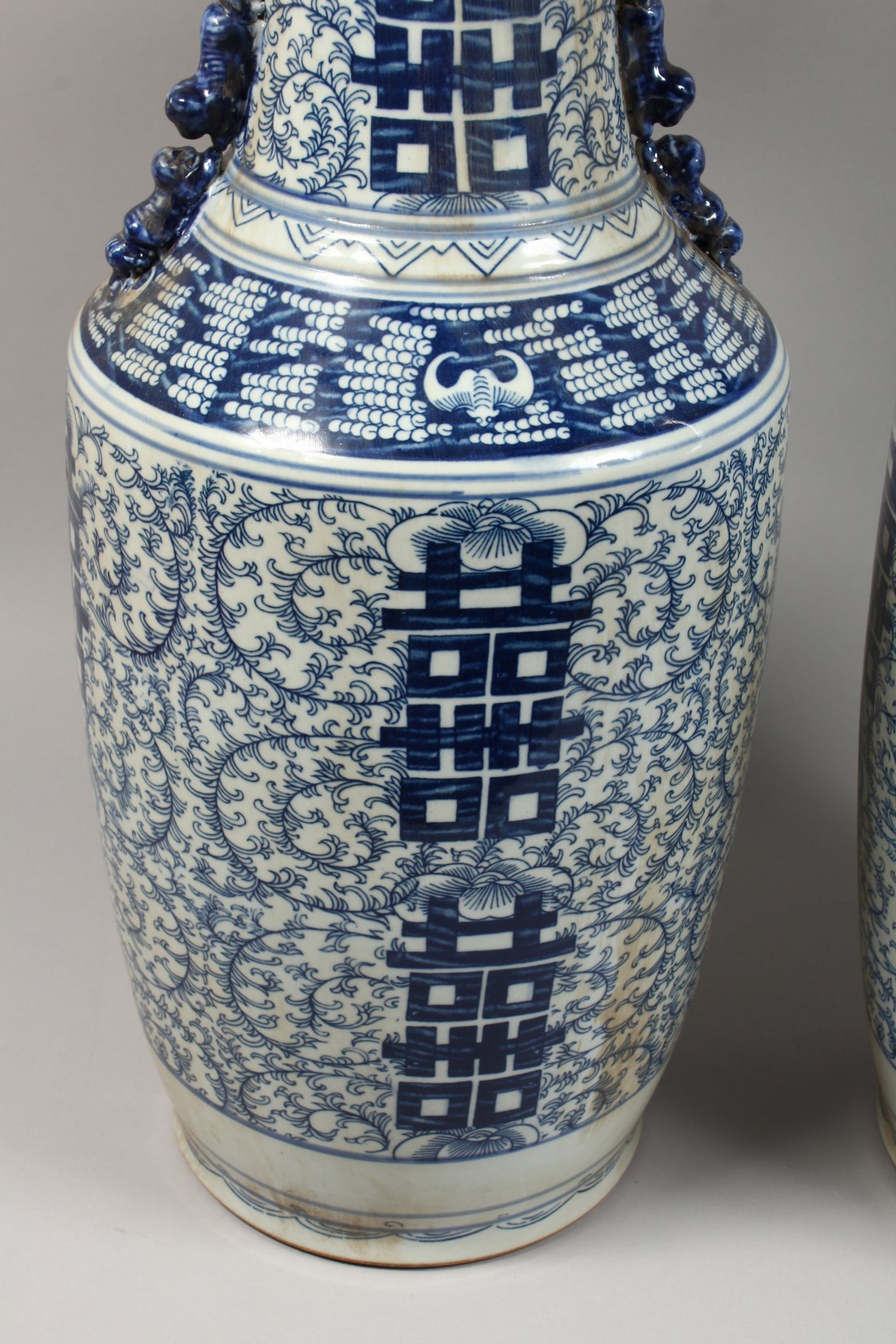 A PAIR OF CHINESE BLUE AND WHITE VASES. 23ins high. - Image 3 of 7