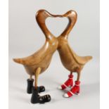 A PAIR OF WOOD LOVERS DUCKS. 19ins high.