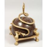 A GILT BRONZE AND MARBLE CENTREPIECE with a curling snake, on a square base with four claw and