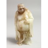 A CHINESE CARVED JADE FIGURE. 7ins high.