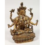 A CHINESE GILT BRONZE DEITY with eight arms. 8.5ins high.