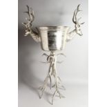 A CHAMPAGNE STAND with deer's head and antlers. 3ft 5ins high.