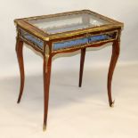 A LATE 19TH CENTURY FRENCH KINGWOOD AND ORMOLU BIJOUTERIE TABLE, with rising top on cabriole legs.