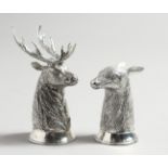 A PAIR OF .800 DEERS’ HEAD SALT AND PEPPERS, stag and doe.