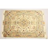 A FINE PERSIAN PART SILK TABRIZ RUG, cream ground with floral decoration. 7ft 2ins x 4ft 11ins.