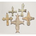 FIVE MEDIUM ROMAN CAST IRON CROSSES.