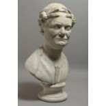 AFTER THE ANTIQUE A PLASTER BUST on a circular base. 21ins high.