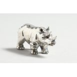 A CAST SILVER RHINO.