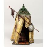 A VERY GOOD VIENNA PAINTED BRONZE TENT, a seated figure inside. 13ins high.