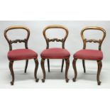 A SET OF THREE VICTORIAN MAHOGANY NAVAL DINING CHAIRS, each with removable legs, balloon backs,