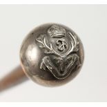 A SILVER TOP CANE with military crest. 29ns long.