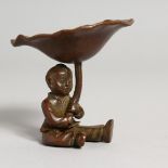 A JAPANESE BRONZE BOY AND LILY. 2.5ins high.