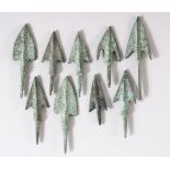 NINE SMALL METAL ARROW HEADS, various sizes; largest 7.5cm.