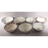 SEVEN LARGE CHINESE PORCELAIN BOWLS, various styles, six painted with native flora, one painted with