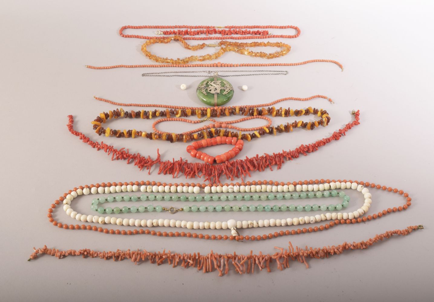 A MIXED LOT OF VARIOUS BEADED NECKLACES, comprising of jadeite, coral and amber, also including a