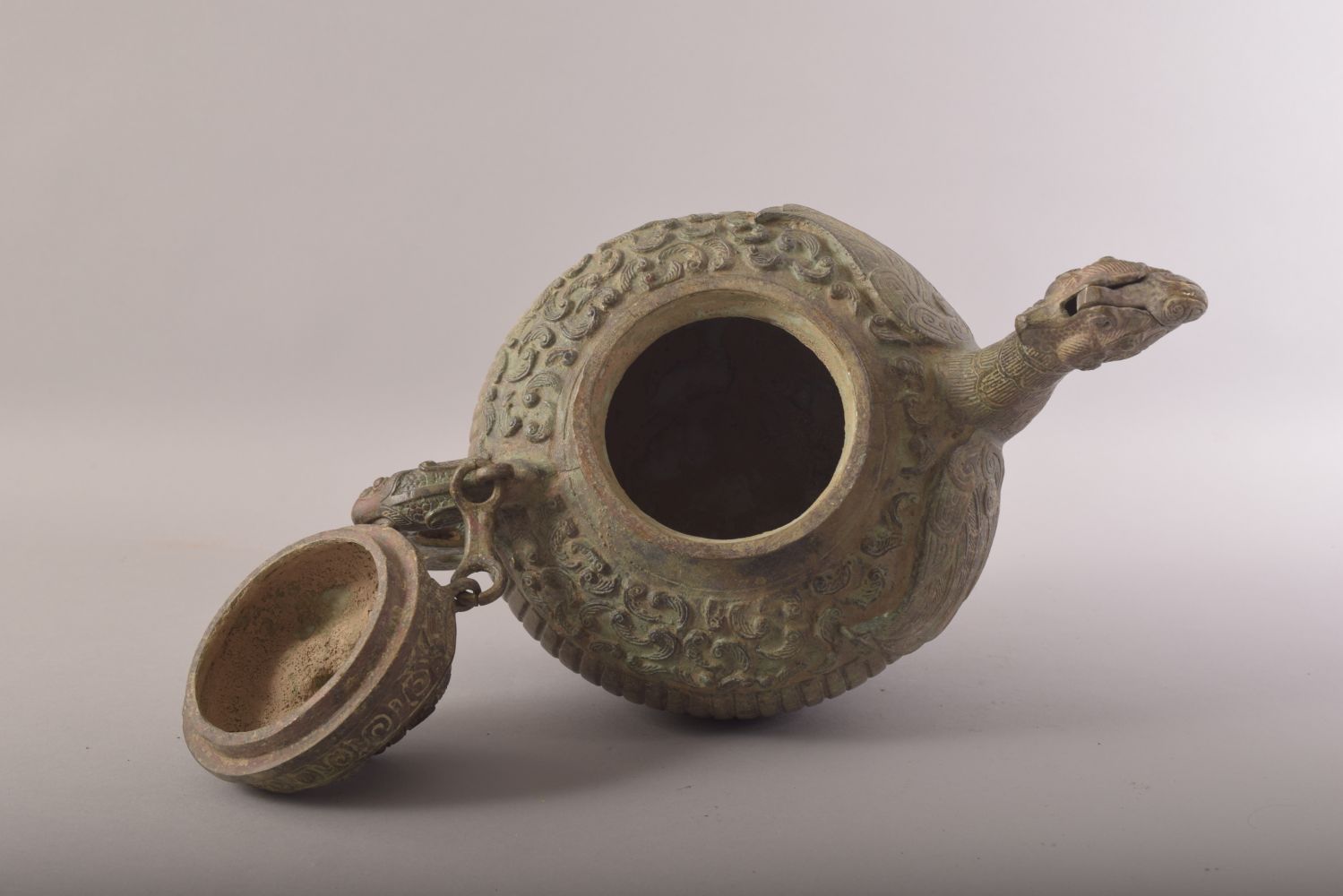 A CHINESE BRONZE ARCHAIC STYLE TEAPOT, with zoomorphic handle, spot and finial, 20cm high. - Image 6 of 7