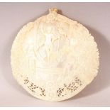 A FINE 19TH CENTURY JERUSALEM CARVED MOTHER OF PEARL SHELL, the centre carved with the figure of