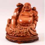 A SUPERB CHINESE HARD STONE CARVING OF BUDDHA holding a scepter seated upon a cloud, on a wooden