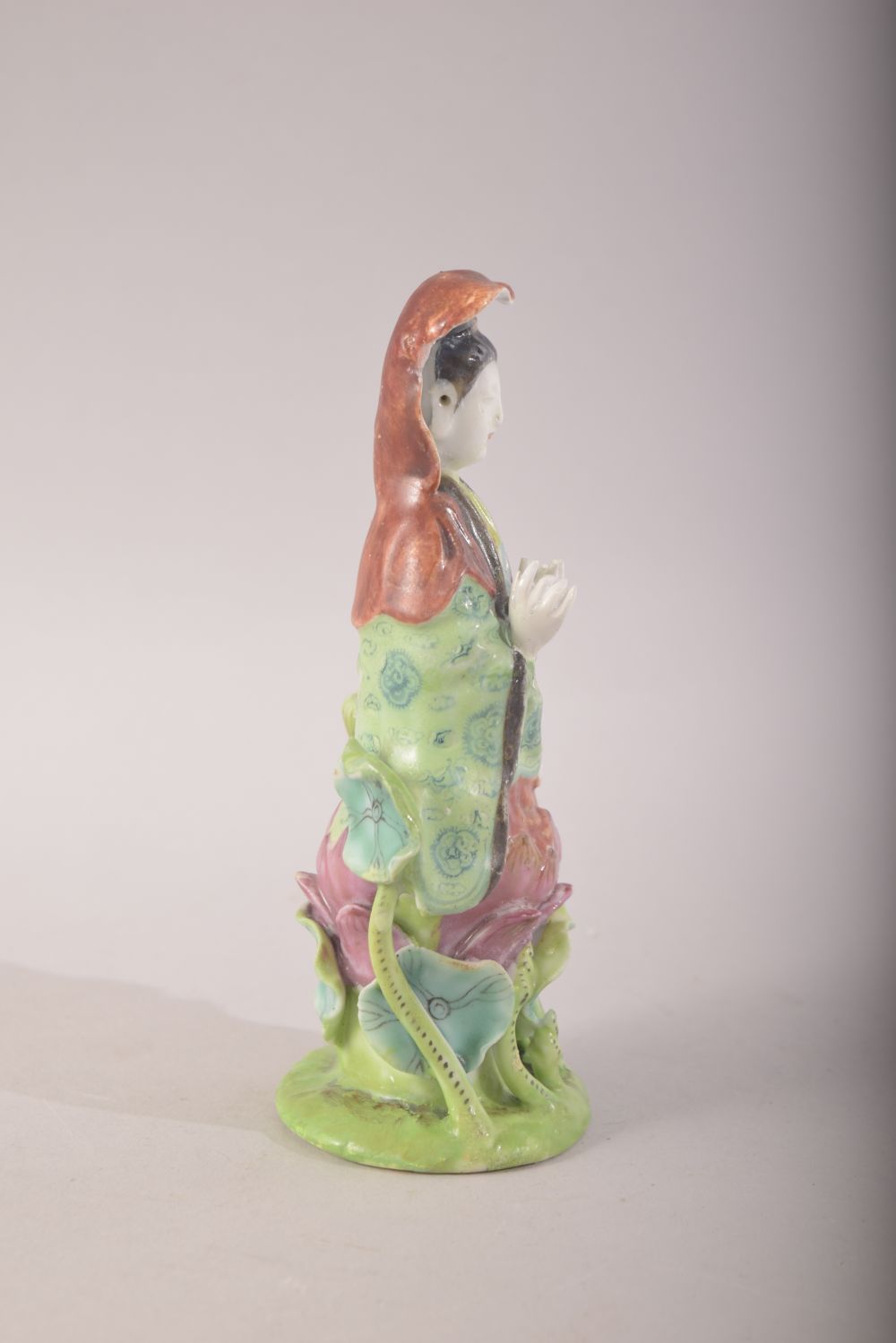A SMALL CHINESE PORCELAIN FIGURE OF A FEMALE amongst lilies, 13cm high. - Image 2 of 7