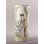 A CHINESE FAMILLE VERTE CYLINDRICAL PORCELAIN VASE, painted with two female figures and script,