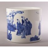 A GOOD CHINESE BLUE AND WHITE PORCELAIN BRUSH POT, decorated with scenes of figures in an outdoor
