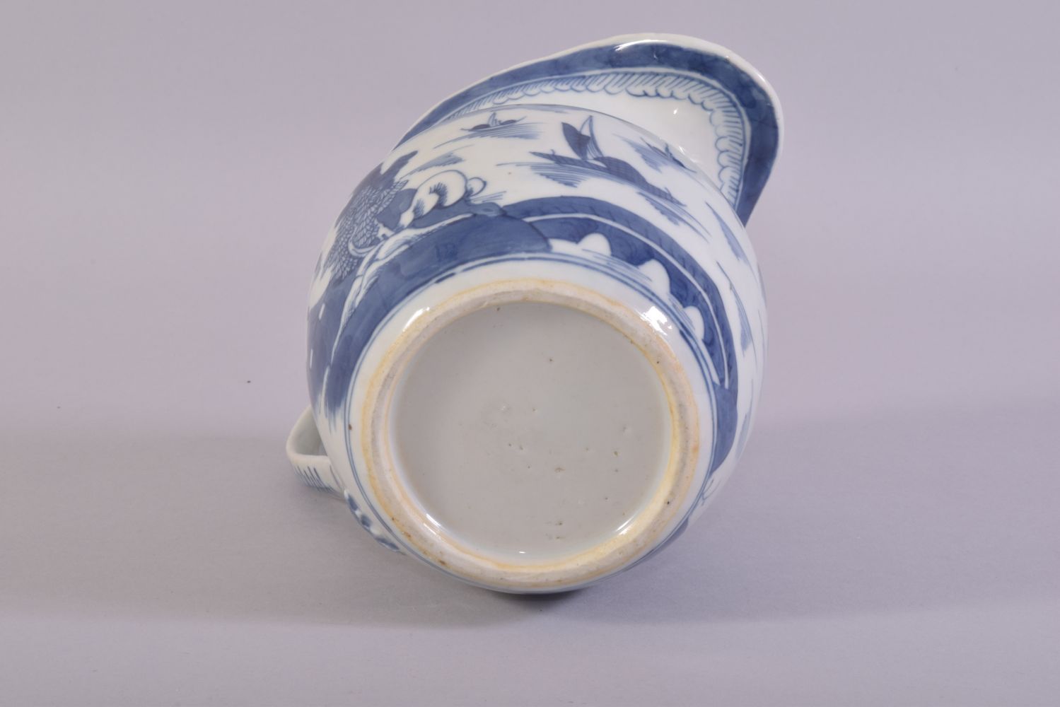 A CHINESE BLUE AND WHITE PORCELAIN JUG, decorated with a landscape scene depicting buildings, - Image 6 of 6