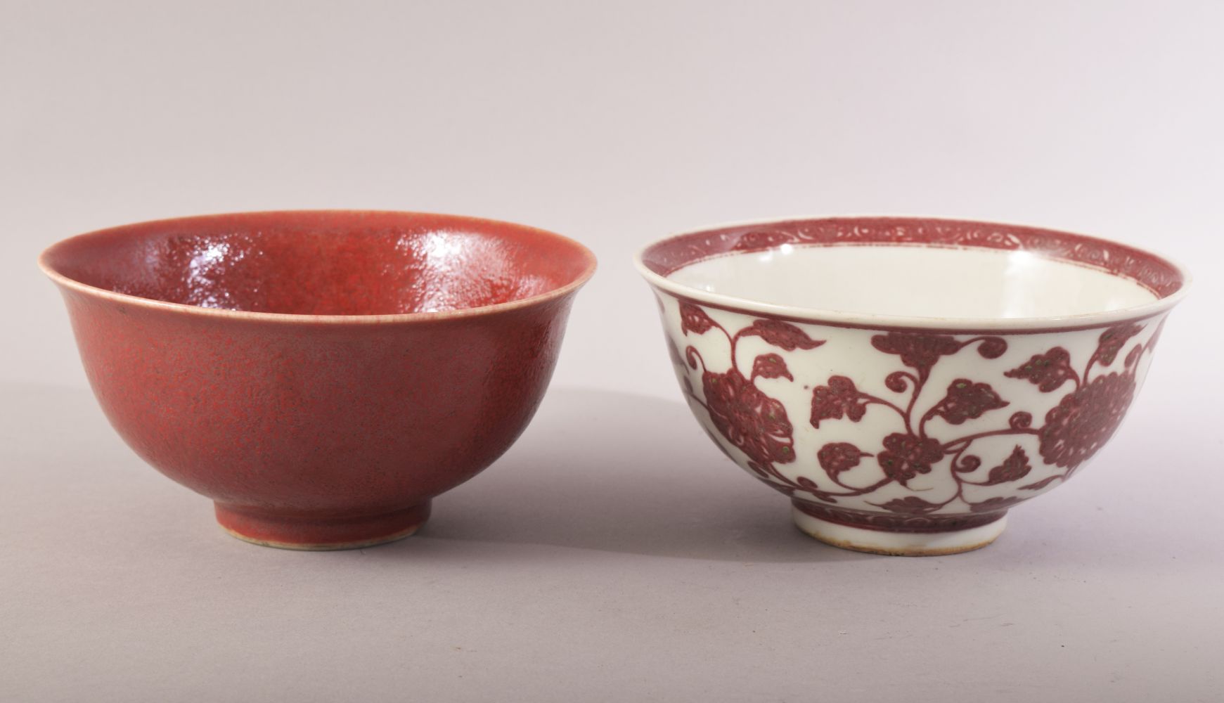 TWO CHINESE PORCELAIN BOWLS, one with red and white floral decoration, the other with red