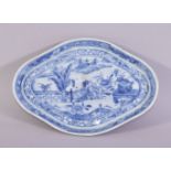 A CHINESE BLUE AND WHITE PORCELAIN DISH, the centre painted with a landscape of a lake, 19cm x