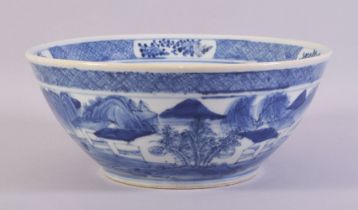A LARGE CHINESE BLUE AND WHITE PORCELAIN BOWL, decorated with a landscape including figures,
